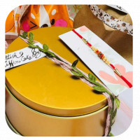 Scottish Tiffin Cake Box with Rakhi online delivery in Noida, Delhi, NCR,
                    Gurgaon